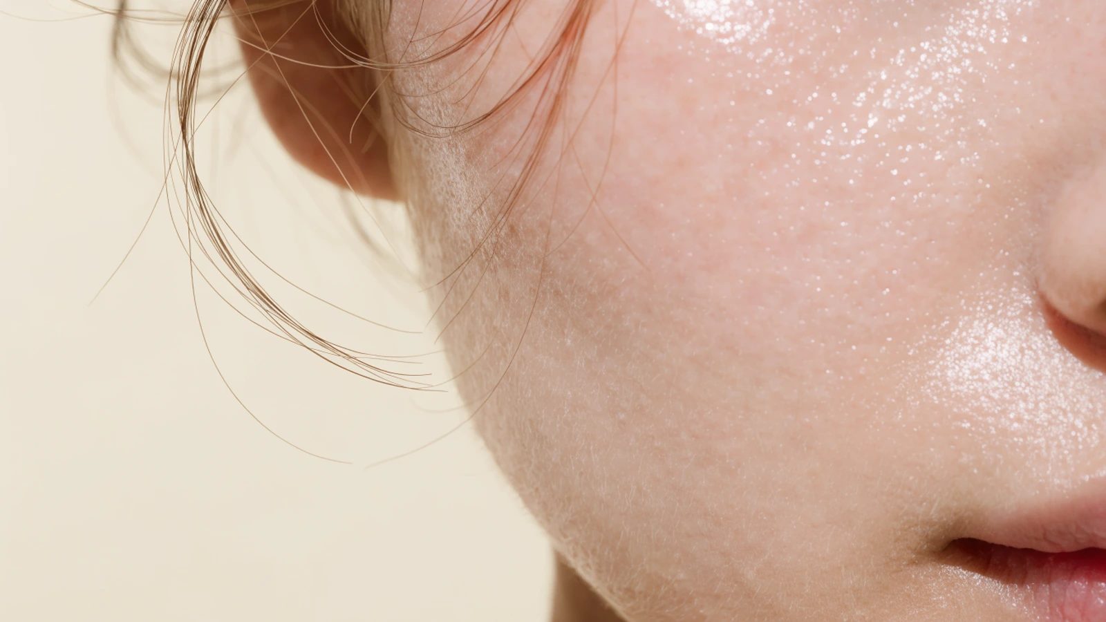 A close view of a cheek and jaw, the skin matte and dry with fine surface texture.